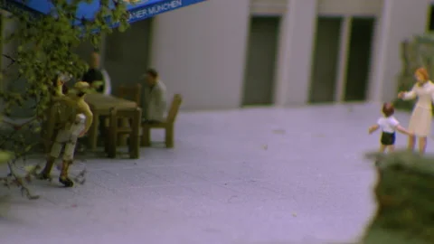 Miniature model with people drinking coffee is shooted on laowa lens Stock Footage 220913510