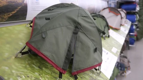 Miniature model of a sample tent on a display stand of a sporting goods store. Stock Footage 311889599