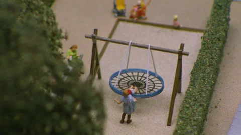 Miniature model with trees and people hanging around shooted on laowa lens Stock Footage 220915715