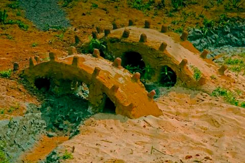 Miniature mud bridge Stock Photos
