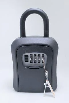 Miniature painter fixing combination lock safe Stock Photos