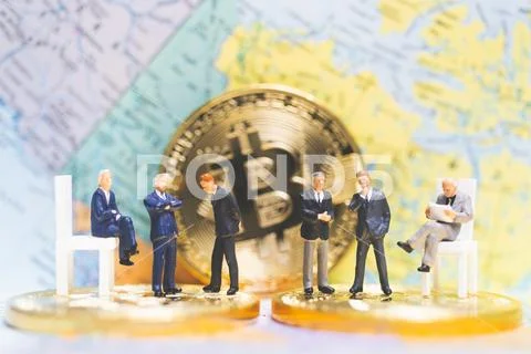 Miniature people: Businessman on stack of coins , business success concept. Stock Photos