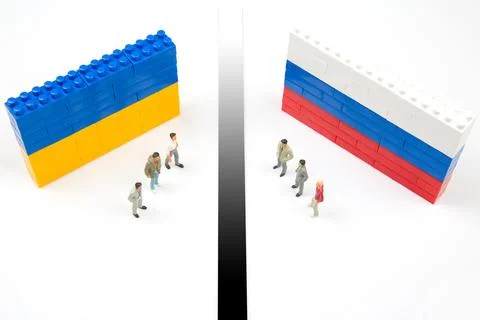 Miniature people. Confrontation between two countries of peoples. National Uk Stock Photos
