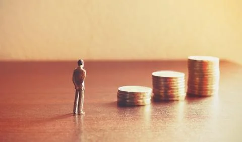 Miniature people looking future with stack coin about financial and money s.. Stock Photos