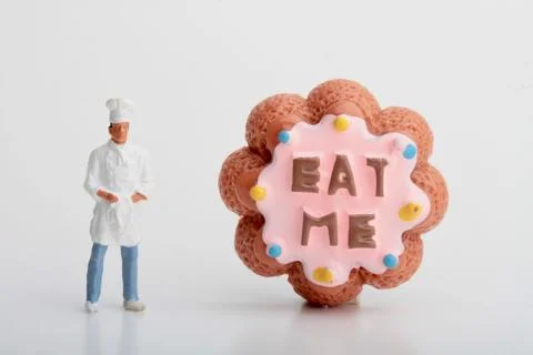 Miniature people: mini chef preparing some food Stock Photos
