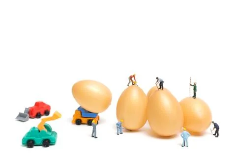 Miniature people work at Easter-eggs for Easter day Stock Photos