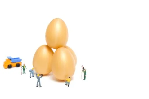 Miniature people work at Easter-eggs for Easter day Stock Photos