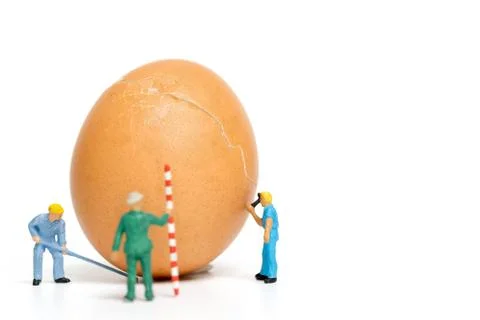 Miniature people work at Easter-eggs for Easter day Stock Photos