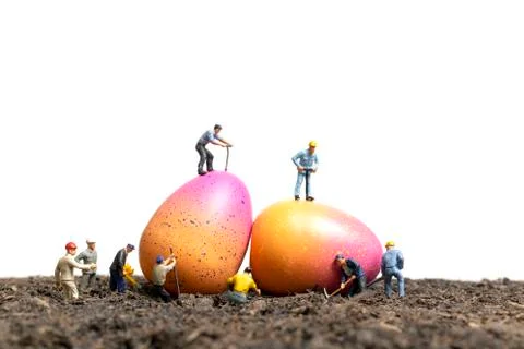Miniature people work at Easter-eggs for Easter day 写真素材