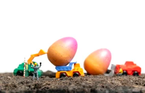 Miniature people work at Easter-eggs for Easter day Stock Photos