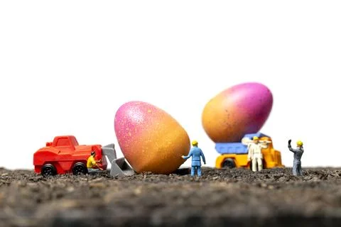 Miniature people work at Easter-eggs for Easter day Stock Photos