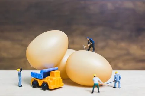 Miniature people work at Easter-eggs for Easter day Stock Photos