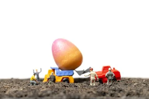 Miniature people work at Easter-eggs for Easter day Stock Photos