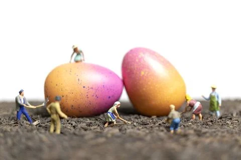 Miniature people work at Easter-eggs for Easter day Stock Photos