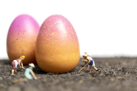 Miniature people work at Easter-eggs for Easter day Stock Photos