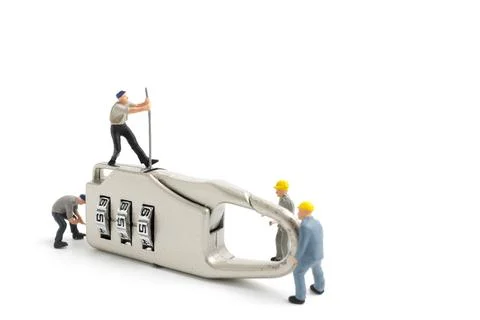 Miniature people worker : Teamwork helps to unlock password on the keys. Te.. Stock Photos