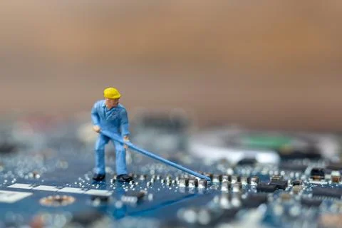 Miniature people working on cpu board, Technology concept Stock Photos