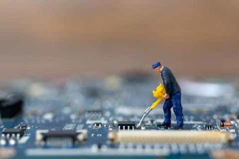 Miniature people working on cpu board, Technology concept Stock Photos