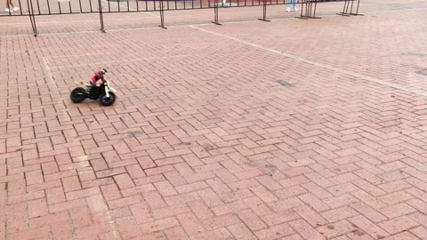 A miniature remote-controlled motorcycle model drives fast Stock Footage 278039793
