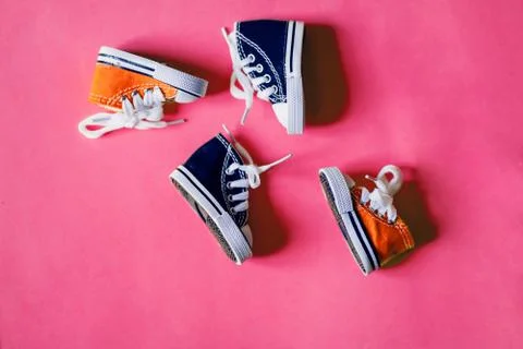 Miniature sneakers isolated on color background Stock Photos