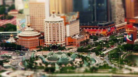 Miniature (tilt-shift) Roundabout in Macau with Casinos in BG at daytime Stock Footage 82876856