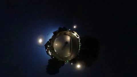 Miniature tiny planet 360 night driving town roads passing trees Stock Footage 198342664