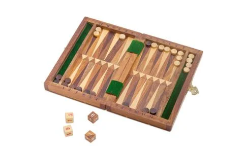 Miniature travelling backgammon set on a light background 写真素材