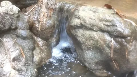 Miniature Waterfall Among Ancient Rocks Видео 334663294