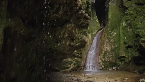 Miniature Waterfall Cascading Down Mossy Gorge Rocks Stock Footage 310231955