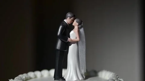 Miniature wedding cake topper Stock Footage 346298687