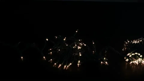 Miniature white lights isolated on black Stock Footage 163850331