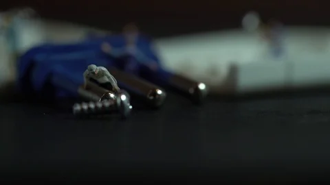 Miniature workers work inside an electric plug 스톡 동영상 127169364