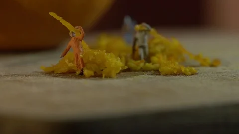 Miniature workers work on orange peel 스톡 동영상 127169498
