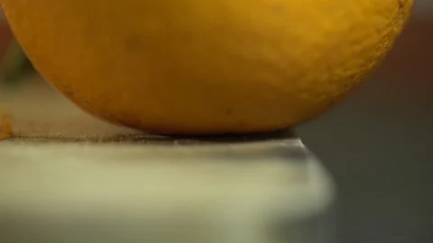 Miniature workers work the peel of an orange Stock Footage 127169235