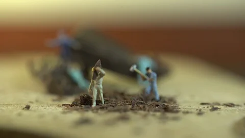 Miniature workers work on a piece of chocolate 스톡 동영상 127169035