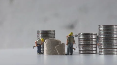 Miniature workers working and piles of coins. Stock Footage 231957186