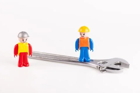 Miniatures of construction workers Stock Photos