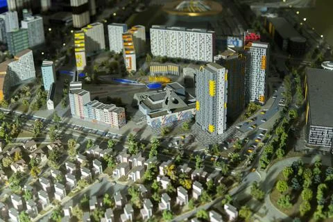 Miniatures layout of a city block with multi-storey buildings and townhouses. Stock Photos