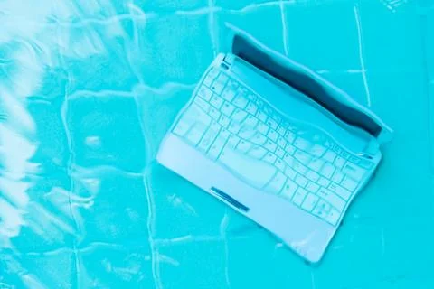 Minicomputer at the bottom of the pool. The concept of a lot of work at work 写真素材