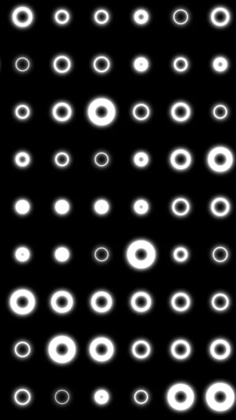Minimal abstract pattern of glowing white rings in a grid on black backgrou.. Stock Footage 327161041