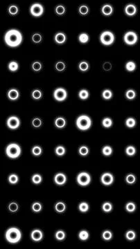 Minimal abstract pattern of glowing white rings in a grid on black backgrou.. 스톡 일러스트