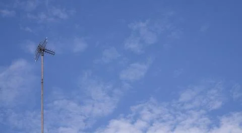 Minimal Antenna Pole In Blue Cloudy Sky Background Stock Photos