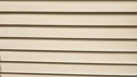 Minimal architectural wall texture with horizontal slats in soft off-white .. Stock Photos