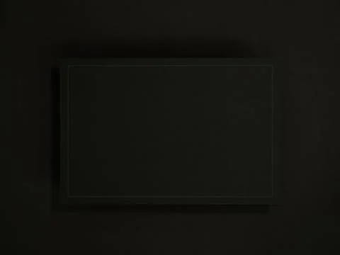 Minimal black card mockup with subtle border and soft shadow on dark textur.. Stock Photos