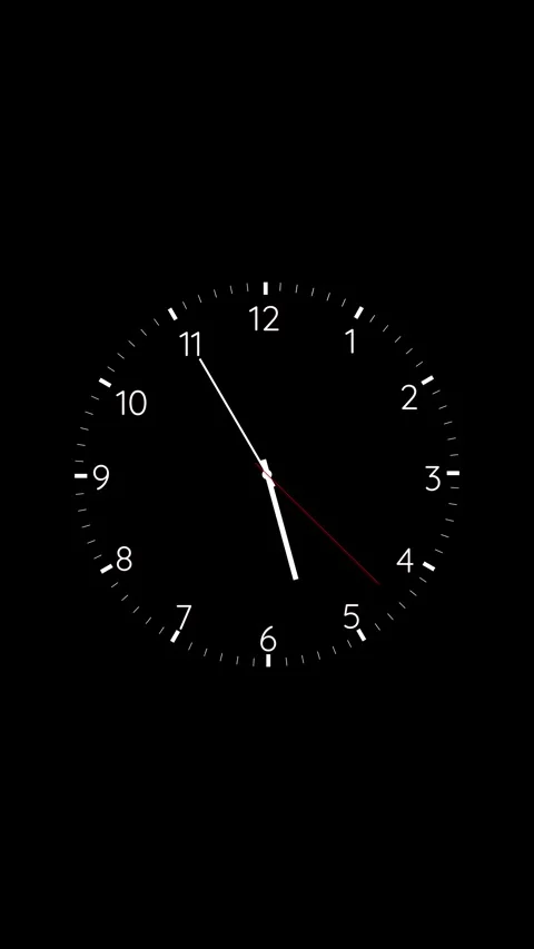 Minimal black clock face white numbers, thin hands, red second pointer on dark e Stock Footage 340571808