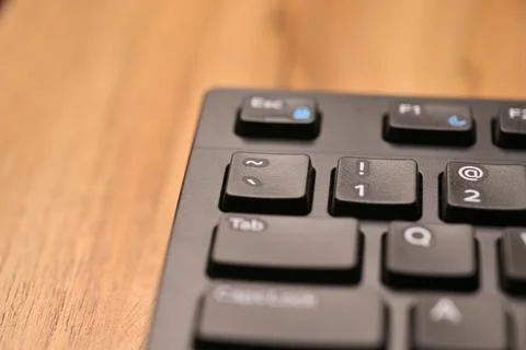 Minimal Black Keyboard Macro Composition Highlighting Backtick and Tilde Ke.. Stock Photos