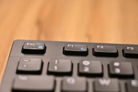 Minimal Black Keyboard Macro Composition Highlighting F1 Function Key in So.. Stock Photos