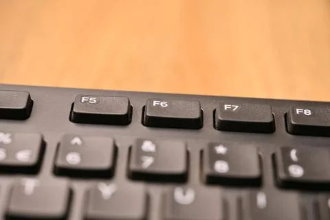 Minimal Black Keyboard Macro Composition Highlighting F6 Function Key in So.. Stock Photos