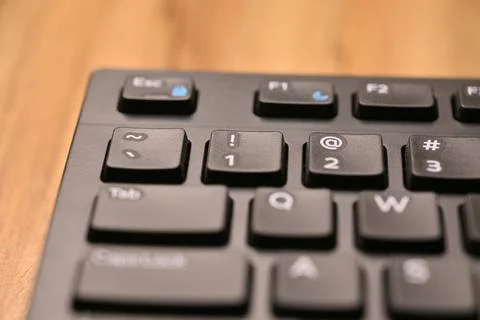 Minimal Black Keyboard Macro Composition Highlighting 1 and Exclamation Mar.. Foto stock