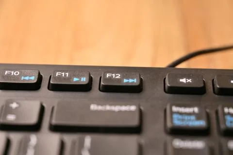 Minimal Black Keyboard Macro Composition Highlighting F12 Function Key in S.. Stock Photos